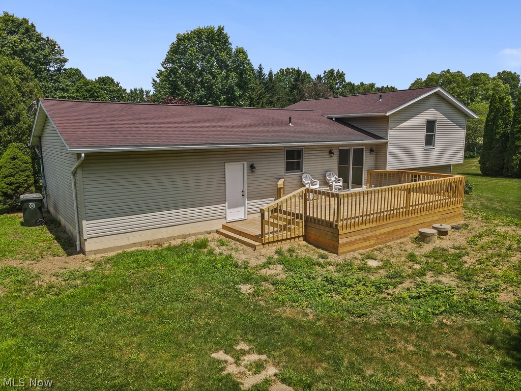2642 Blake Road Wadsworth, OH 44281 - Photo 42 of 46 Rear exterior featuring a spacious wood deck with railing, providing outdoor living space