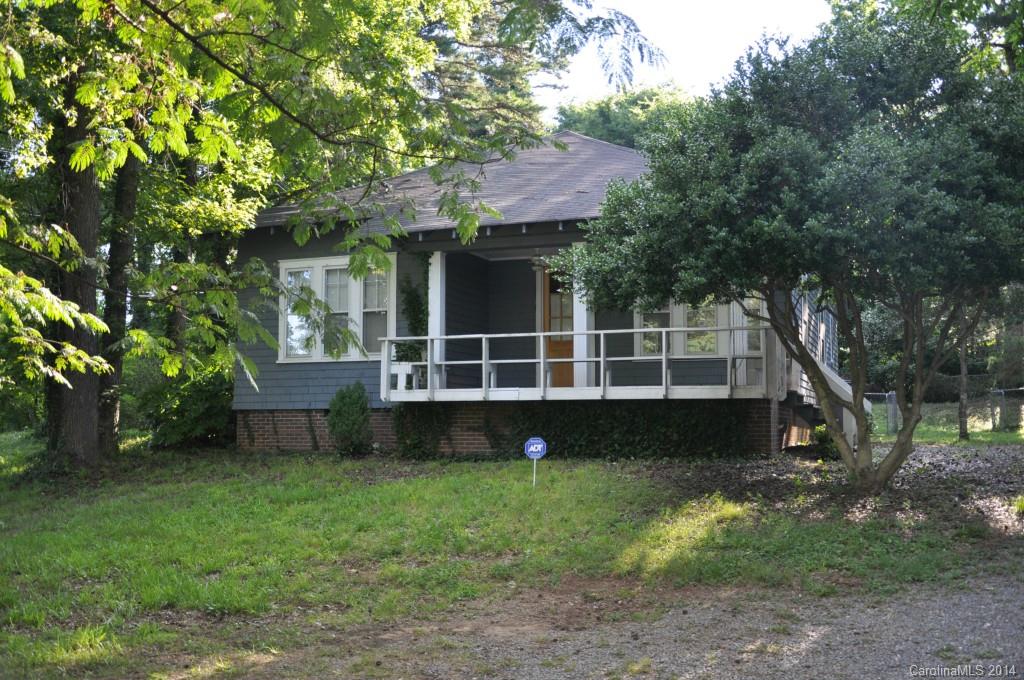 5423 Park Road Charlotte, NC 28209 - Photo 1 of 13 a view of house with backyard and a garden