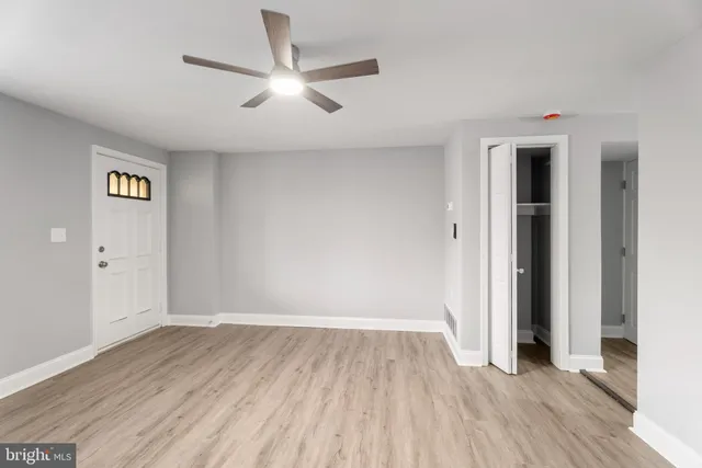 a kitchen with a refrigerator a stove a sink and a window