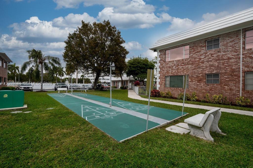 400 South Cypress Road, Unit 424 Pompano Beach, FL 33060 - Photo 17 of 29 a view of a house with a backyard