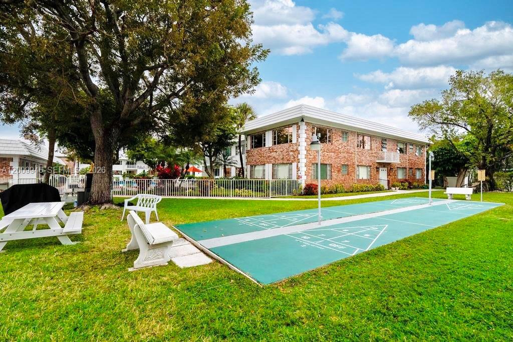 400 South Cypress Road, Unit 424 Pompano Beach, FL 33060 - Photo 19 of 29 a view of a house with a backyard