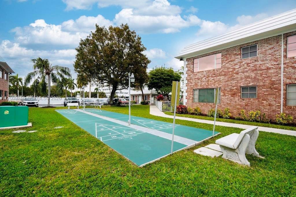 400 South Cypress Road, Unit 424 Pompano Beach, FL 33060 - Photo 20 of 29 a view of a house with swimming pool and yard