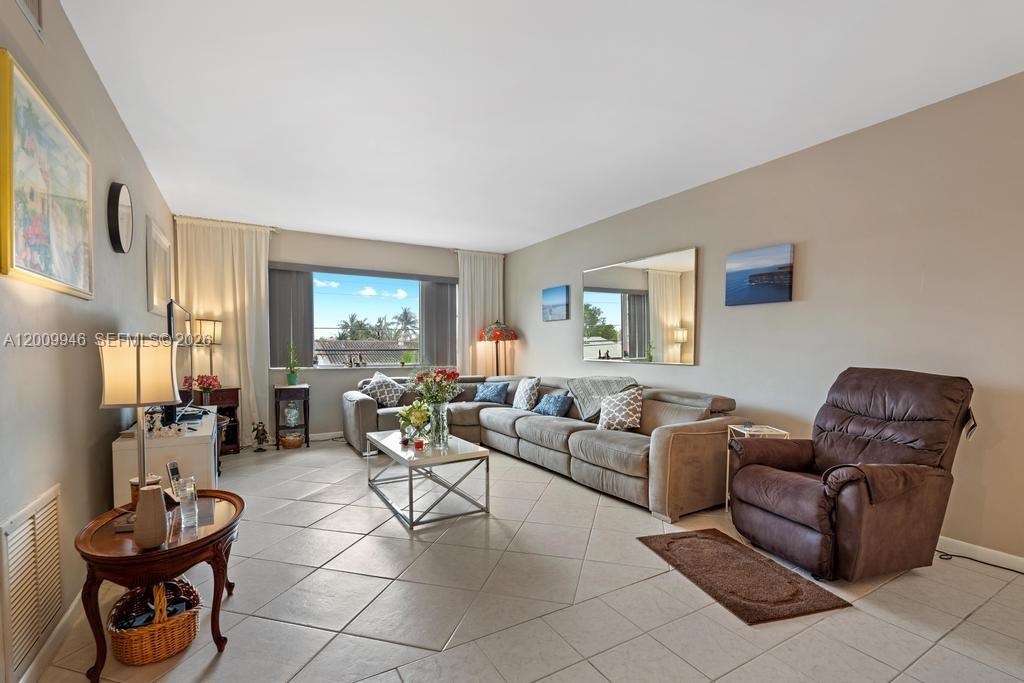 400 South Cypress Road, Unit 424 Pompano Beach, FL 33060 - Photo 28 of 29 a living room with furniture and a window