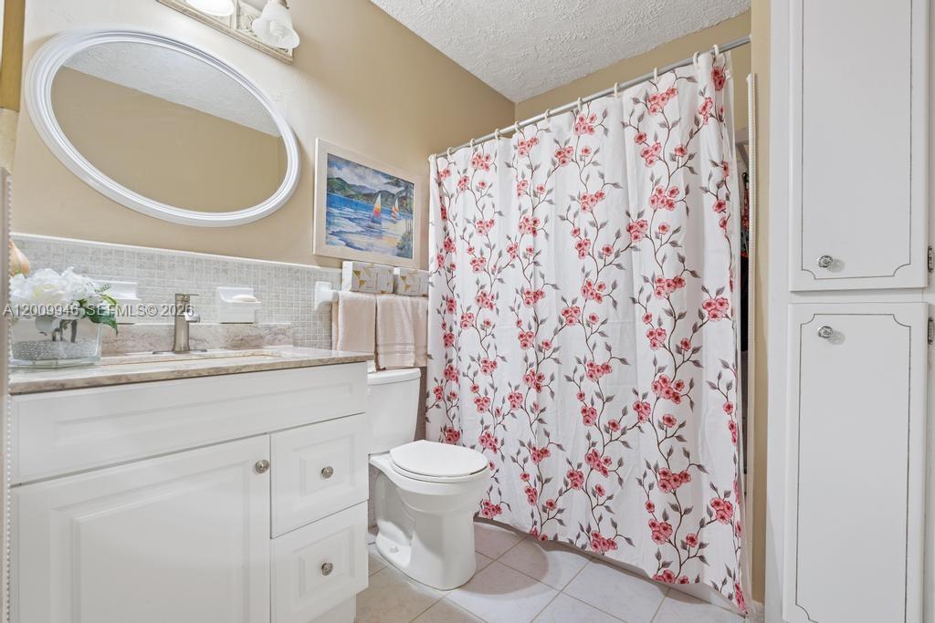 400 South Cypress Road, Unit 424 Pompano Beach, FL 33060 - Photo 10 of 29 a bathroom with a toilet and a sink