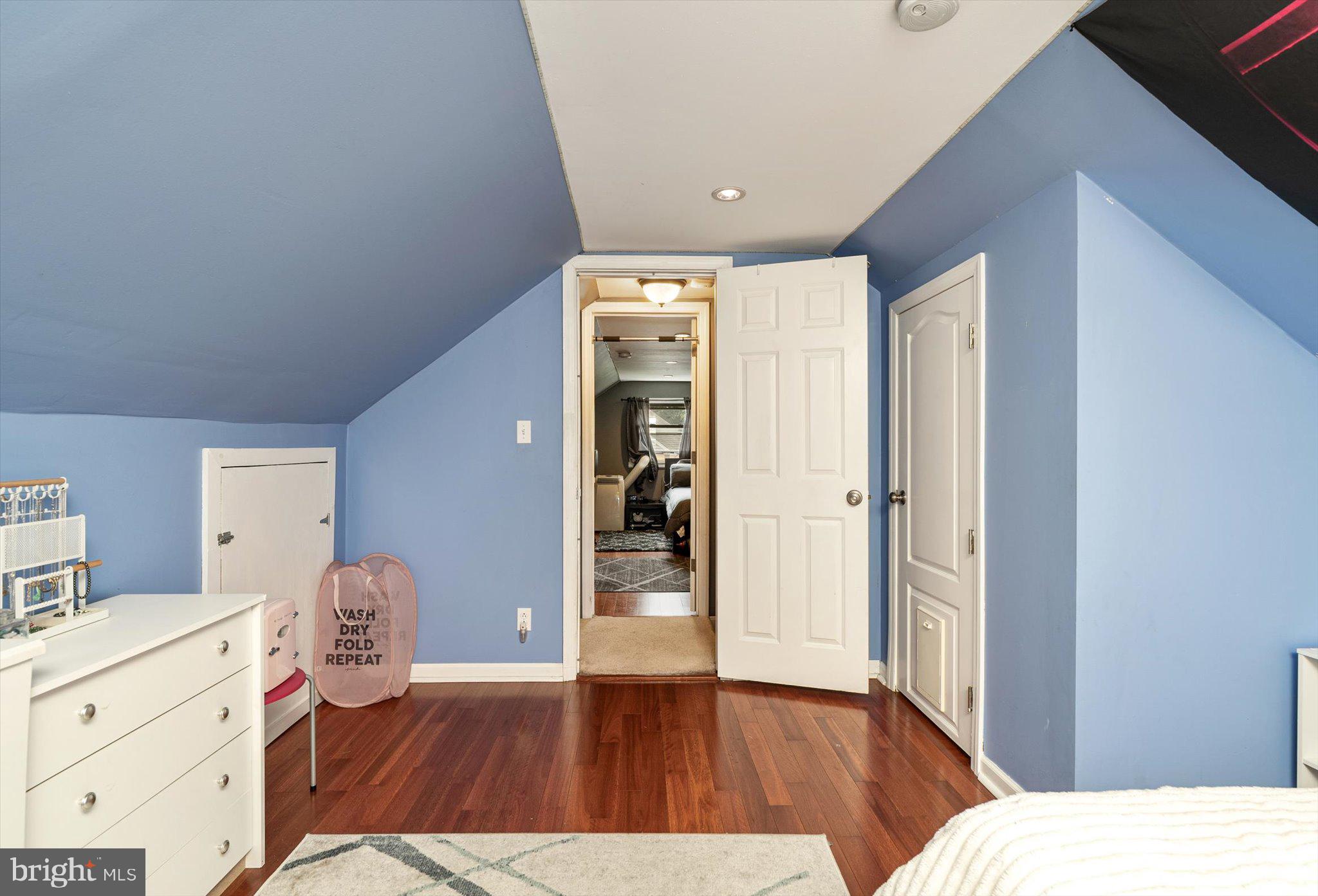 25 Holt Circle Hamilton, NJ 08619 - Photo 23 of 29 a bedroom with a bed and wooden floor