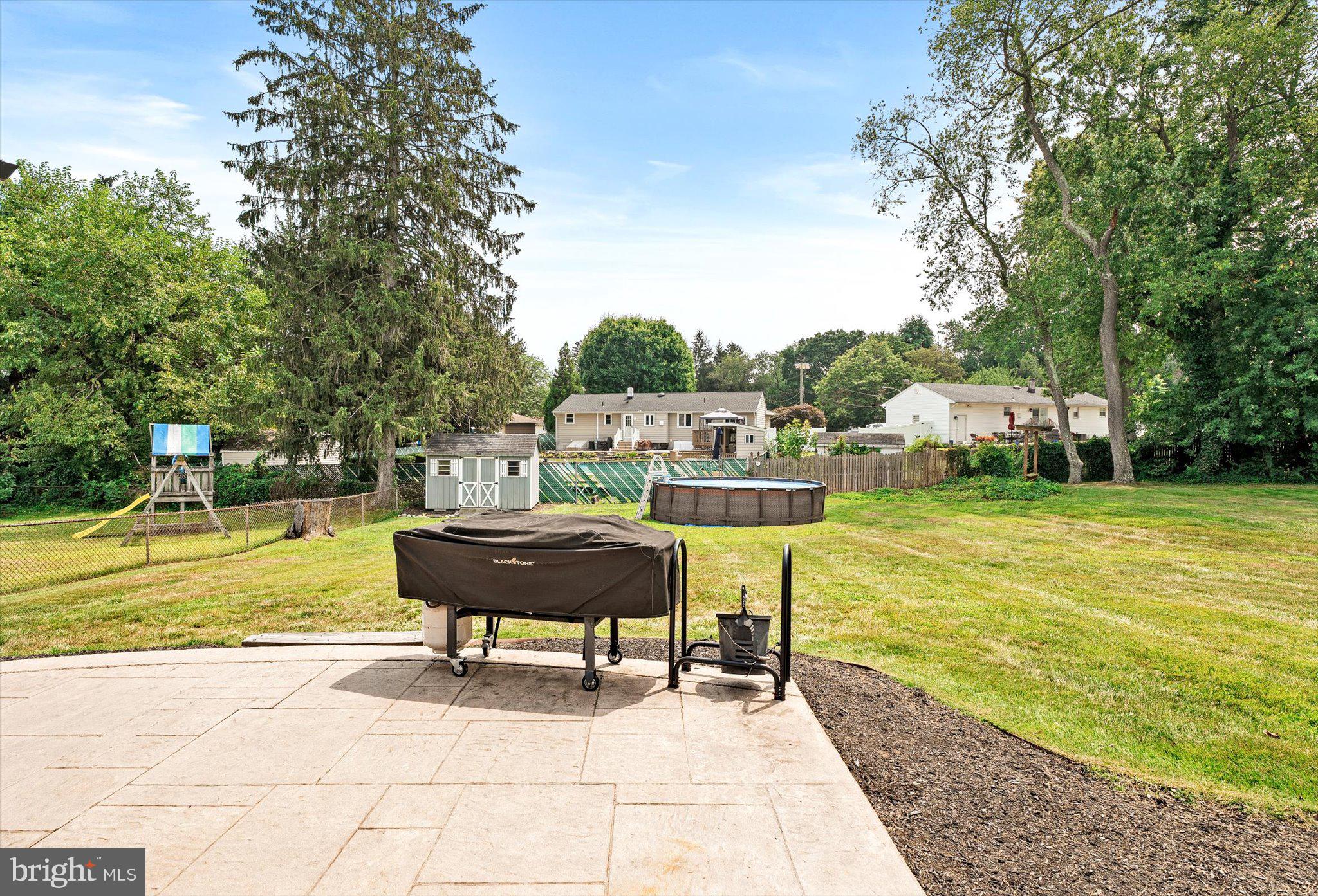 25 Holt Circle Hamilton, NJ 08619 - Photo 26 of 29 a view of a swimming pool with a lounge chairs