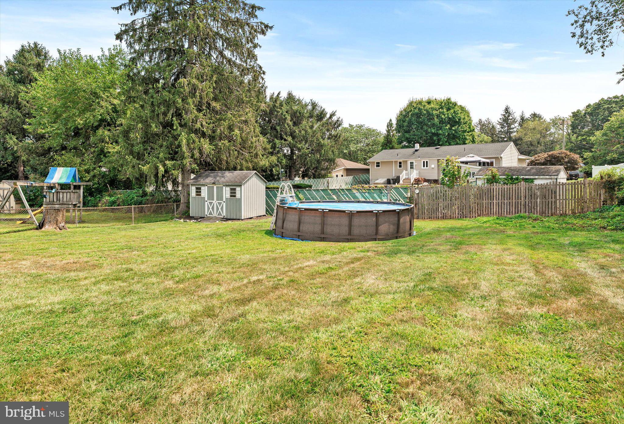25 Holt Circle Hamilton, NJ 08619 - Photo 28 of 29 a view of a swimming pool with a lounge chair