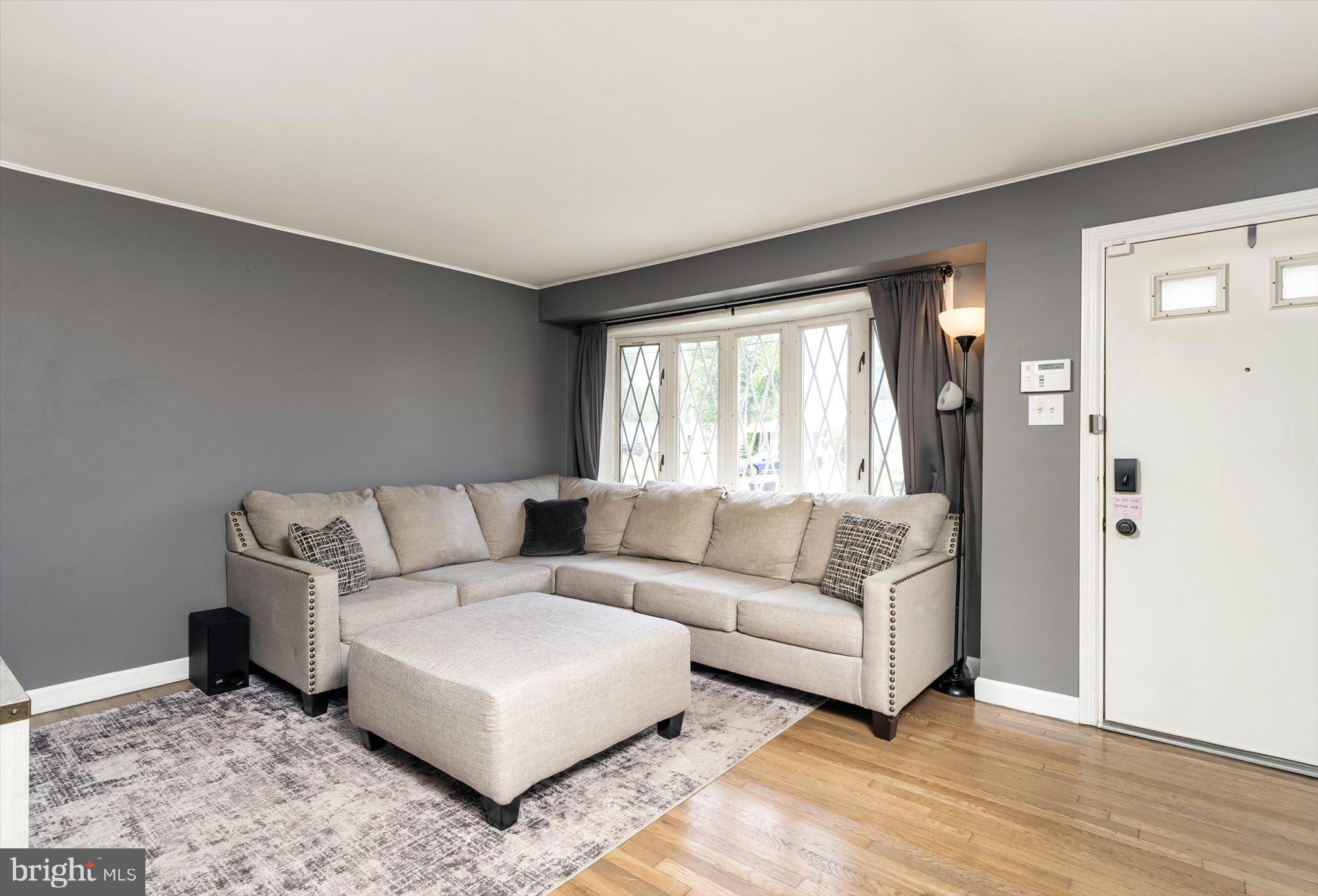 25 Holt Circle Hamilton, NJ 08619 - Photo 5 of 29 a living room with furniture and a large window
