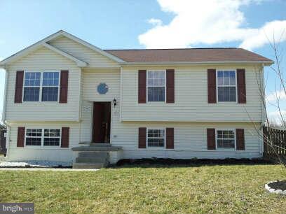 834 Oak Lee Drive Ranson, WV 25438 - Photo 1 of 6 a front view of a house with a yard