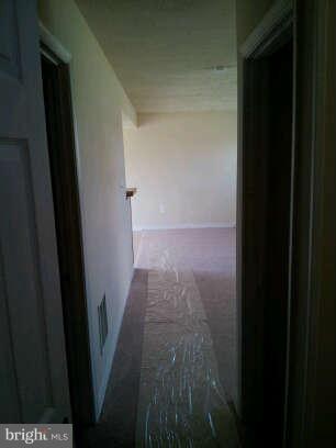834 Oak Lee Drive Ranson, WV 25438 - Photo 5 of 6 a view of hallway with wooden floor
