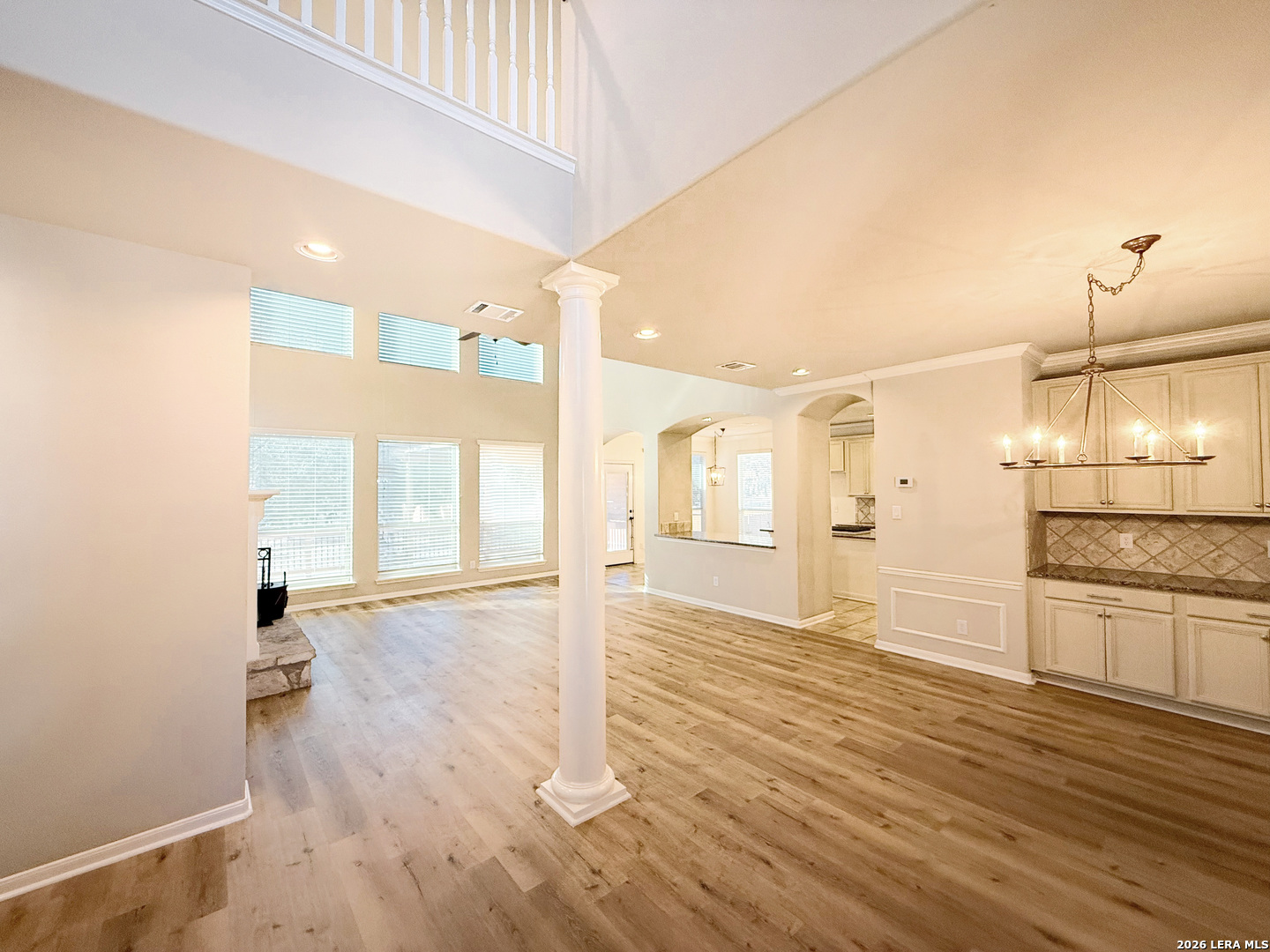 16015 Ponderosa Pth Helotes, TX 78023 - Photo 11 of 49 a view of a kitchen with wooden floor and a window