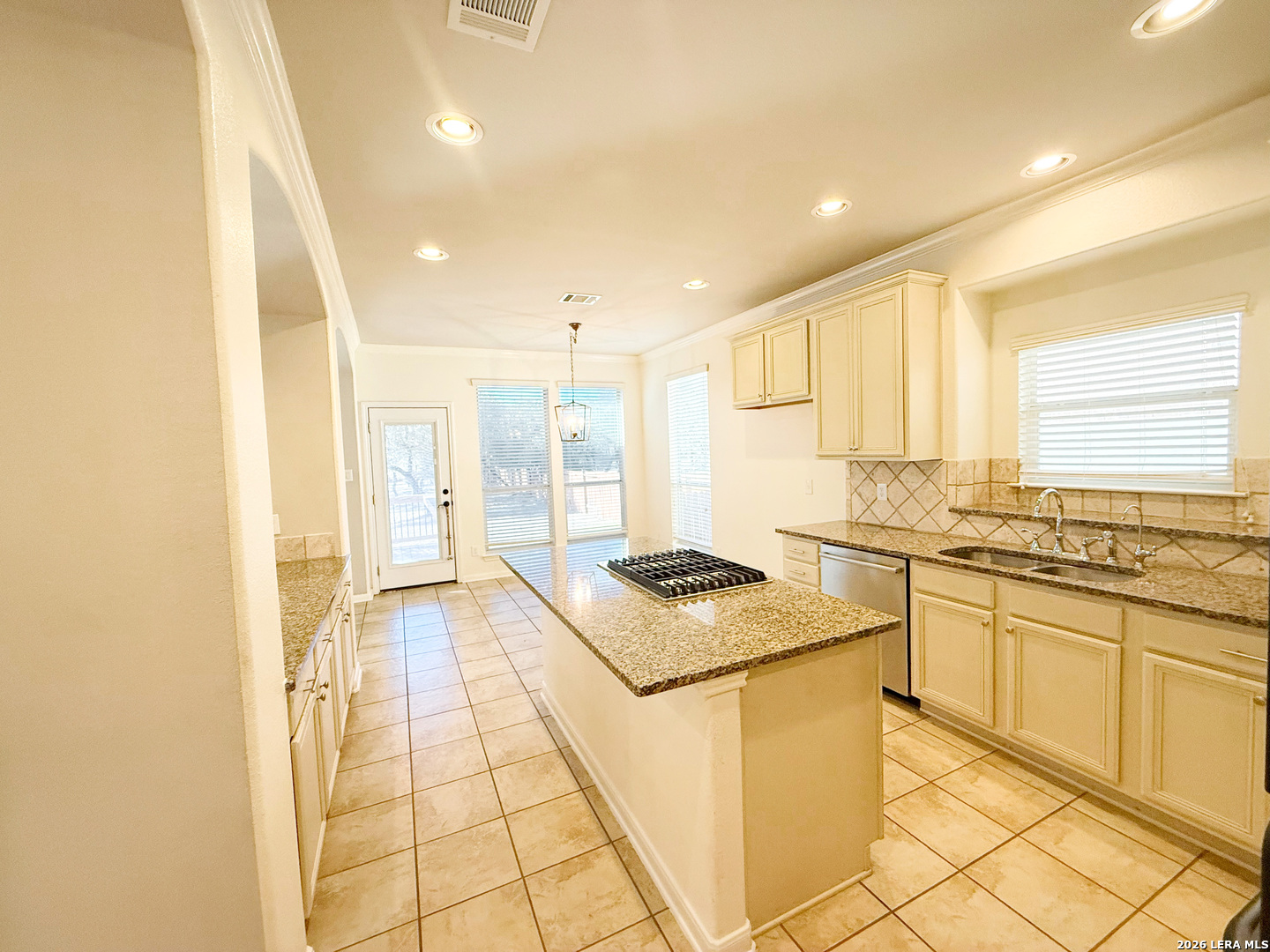 16015 Ponderosa Pth Helotes, TX 78023 - Photo 15 of 49 a kitchen with stainless steel appliances granite countertop a sink and a stove