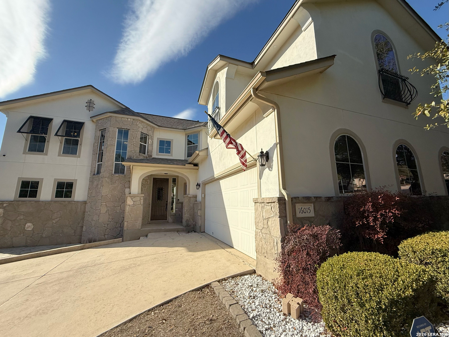16015 Ponderosa Pth Helotes, TX 78023 - Photo 2 of 49 a front view of a house with a yard
