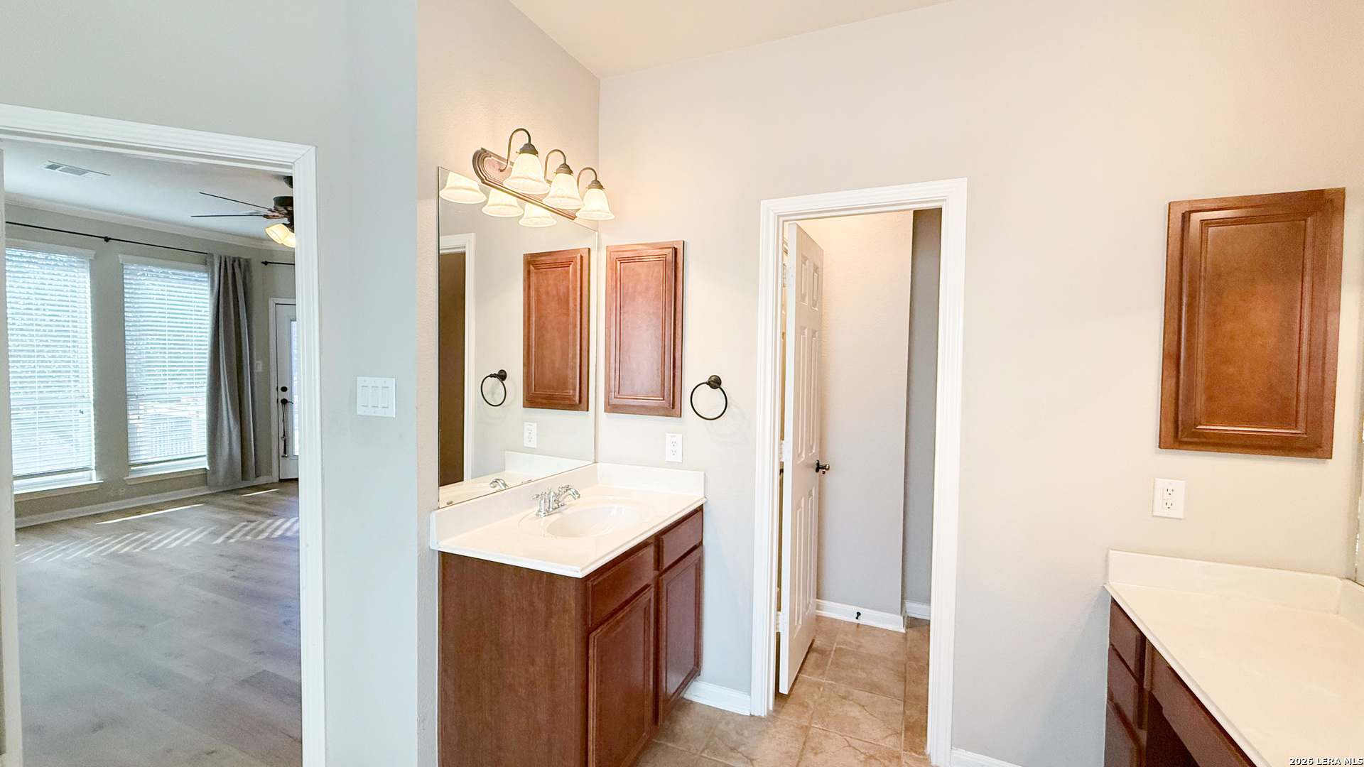 16015 Ponderosa Pth Helotes, TX 78023 - Photo 26 of 49 a bathroom with a sink and a mirror