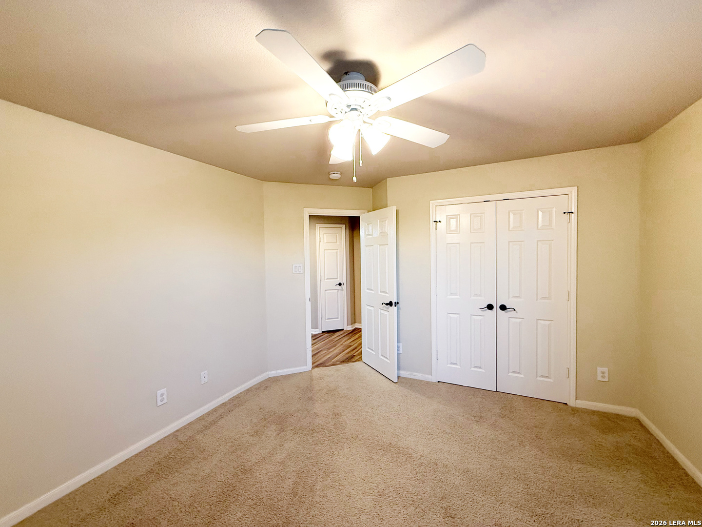 16015 Ponderosa Pth Helotes, TX 78023 - Photo 38 of 49 a view of an empty room and chandelier fan