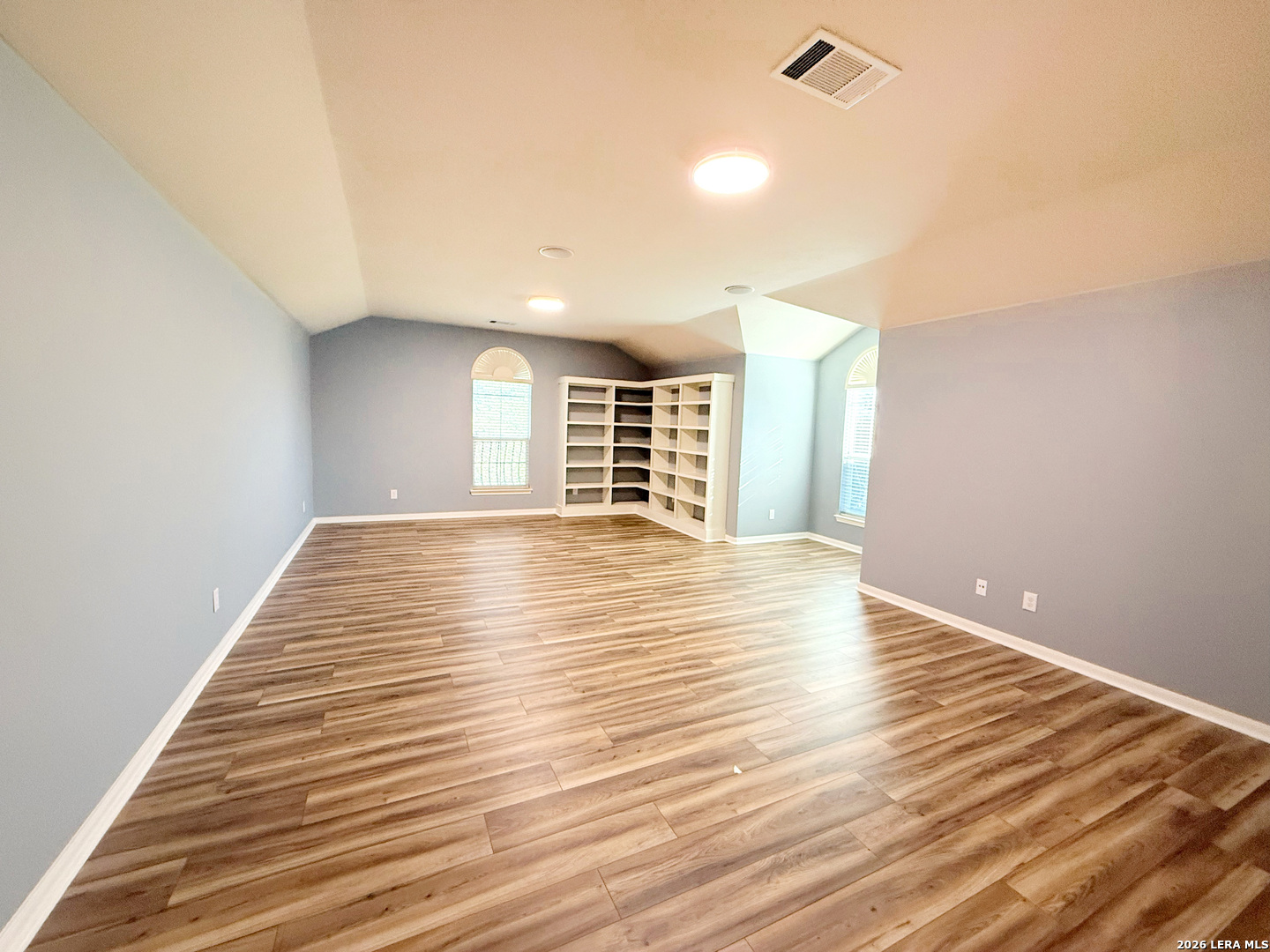 16015 Ponderosa Pth Helotes, TX 78023 - Photo 39 of 49 a view of empty room with wooden floor