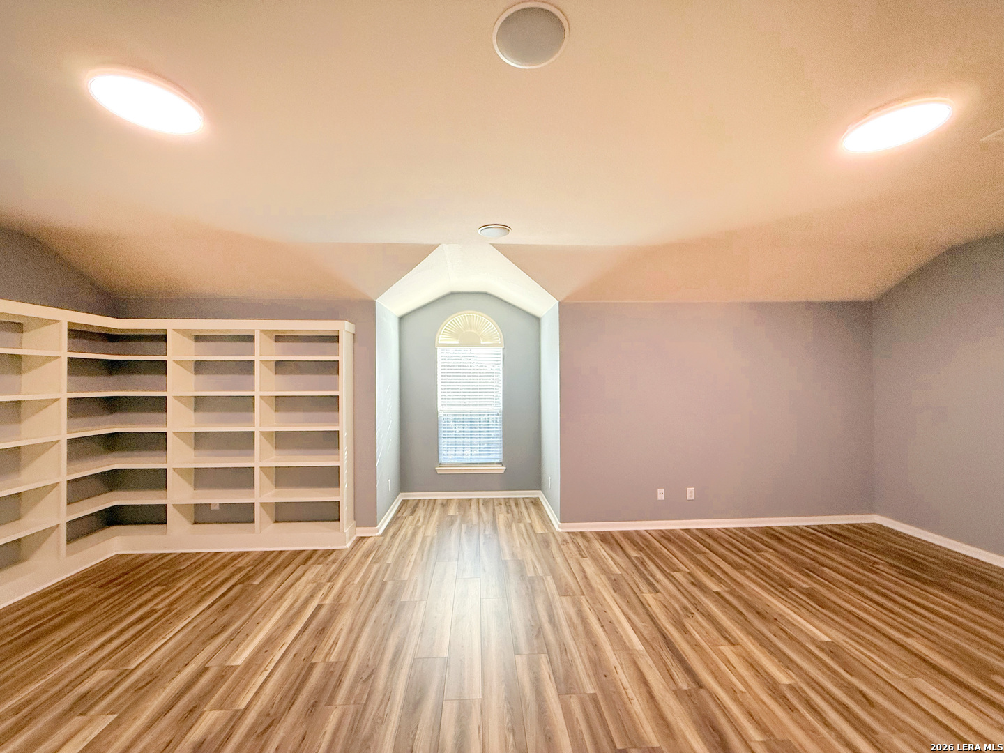 16015 Ponderosa Pth Helotes, TX 78023 - Photo 40 of 49 wooden floor in an empty room with a window