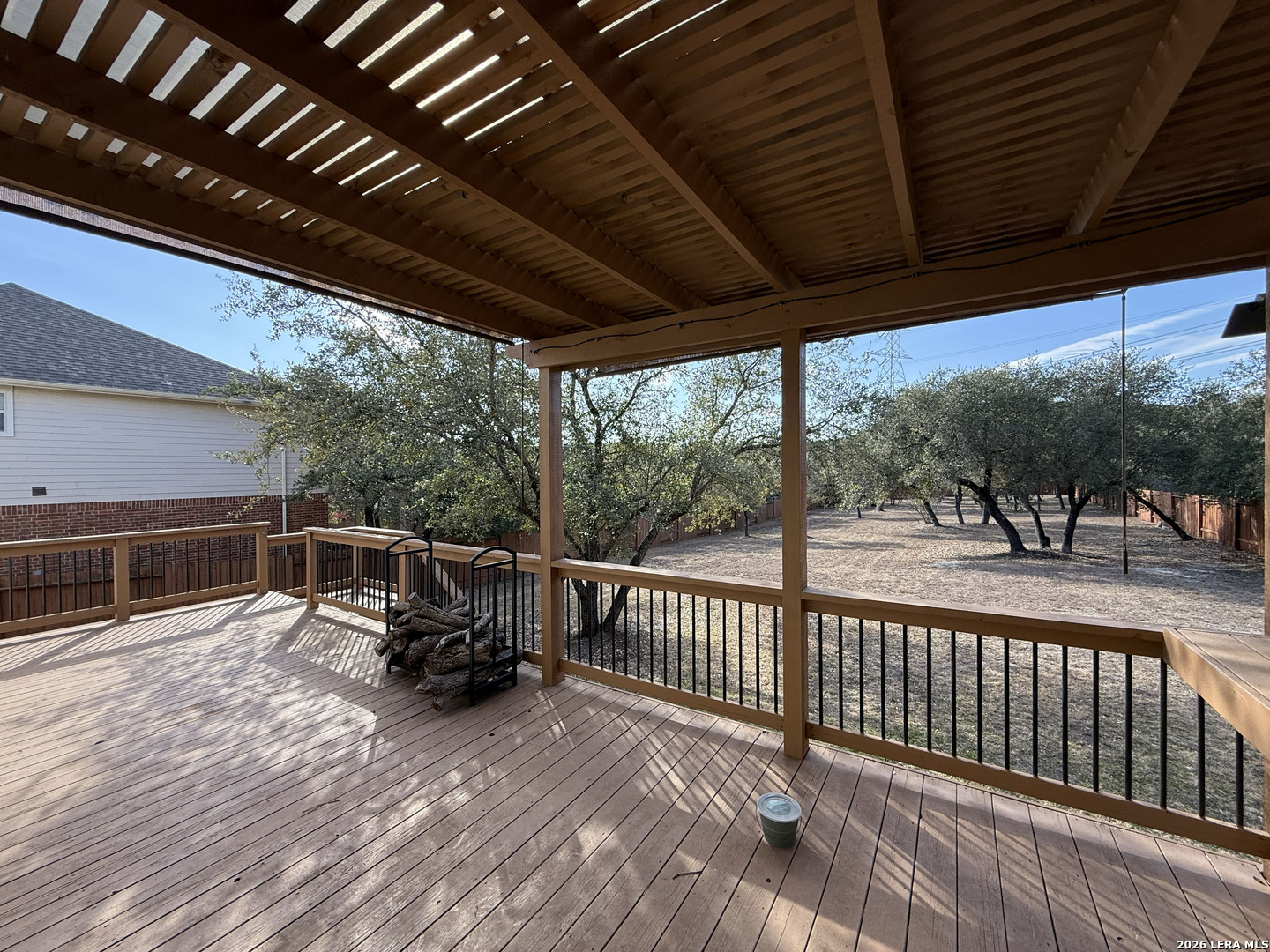 16015 Ponderosa Pth Helotes, TX 78023 - Photo 45 of 49 a view of a patio with table and chairs and wooden floor