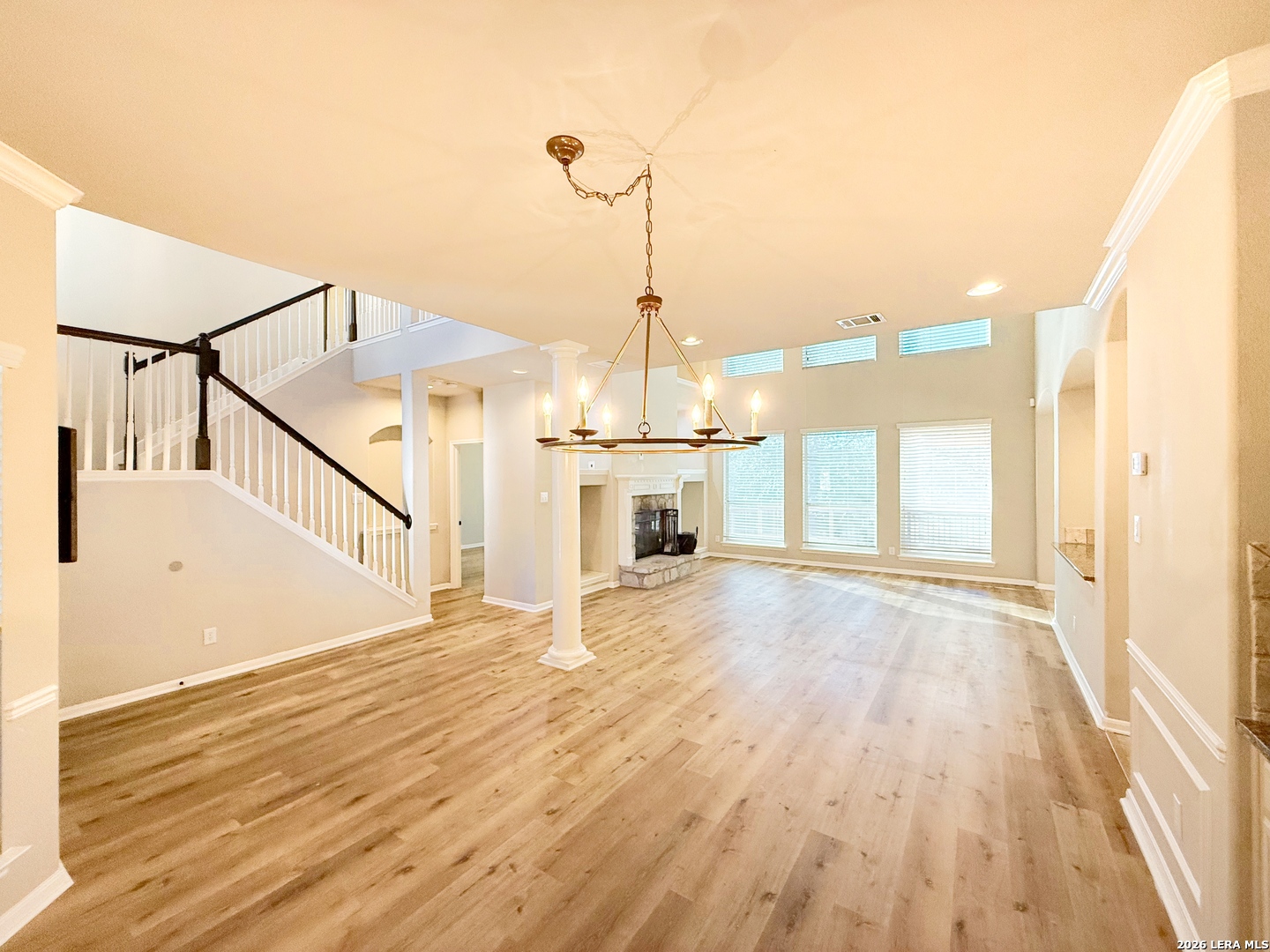 16015 Ponderosa Pth Helotes, TX 78023 - Photo 7 of 49 a view of a room with wooden floor and staircase