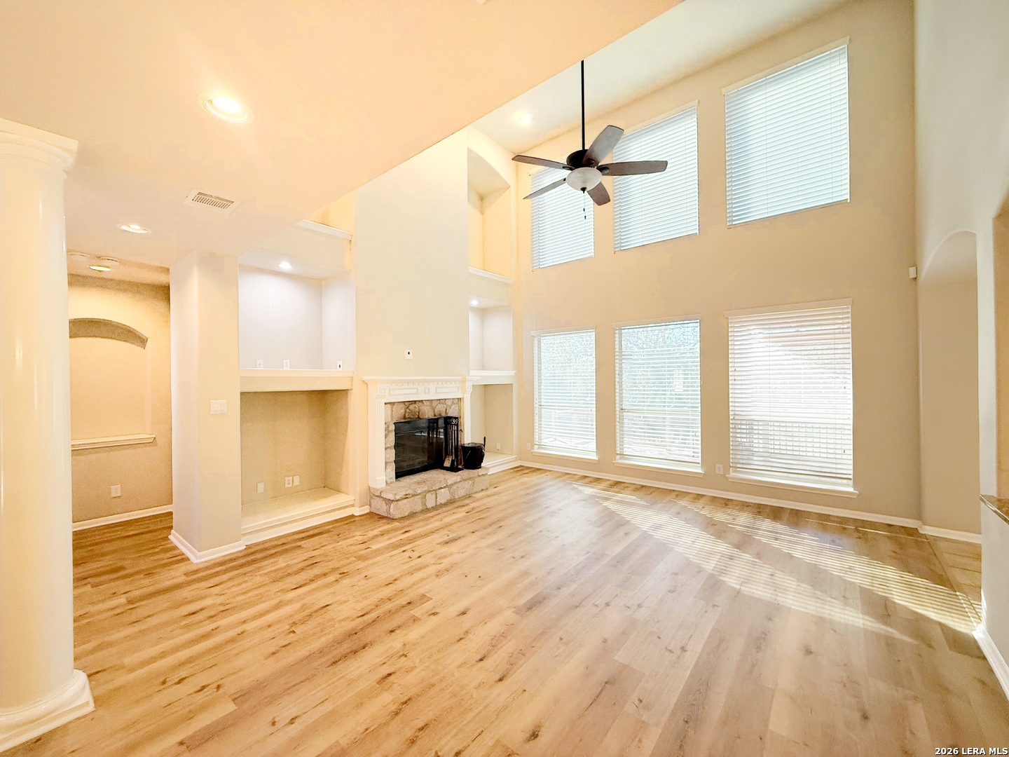 16015 Ponderosa Pth Helotes, TX 78023 - Photo 8 of 49 a view of an empty room with window and a kitchen