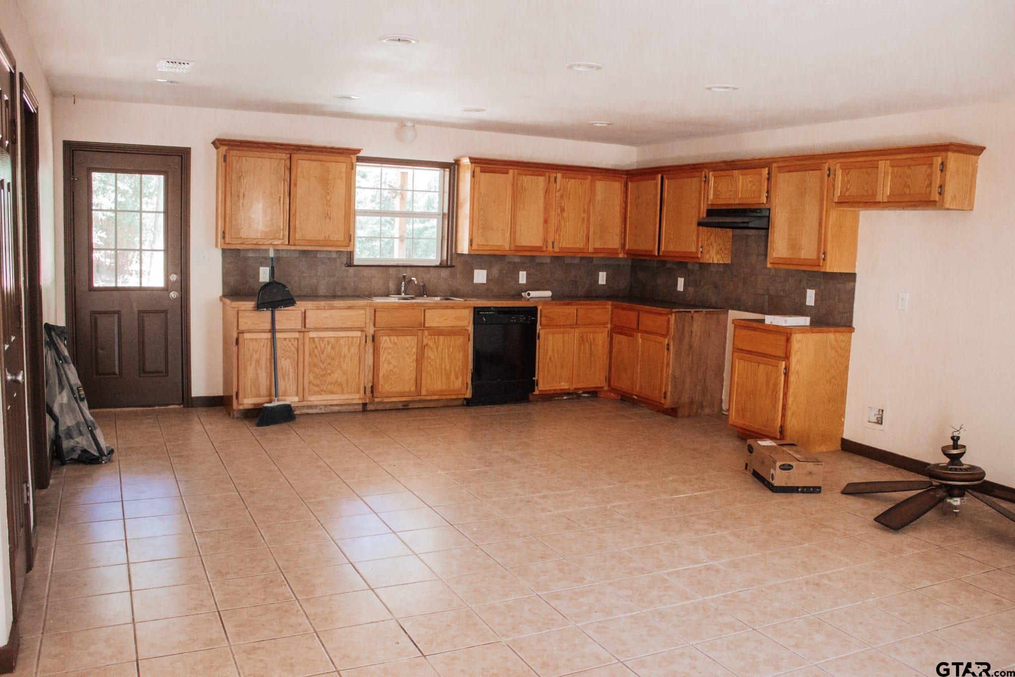 185 Caroline Street Rusk, TX 75785 - Photo 3 of 14 a large kitchen with a large window