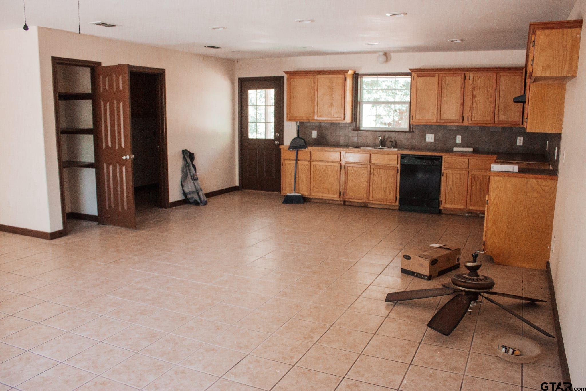 185 Caroline Street Rusk, TX 75785 - Photo 4 of 14 a kitchen with sink cabinets and appliances