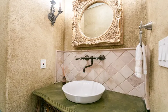 a bathroom with a sink and a mirror