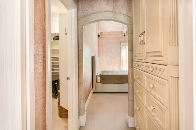 a view of walk in closet and bathroom