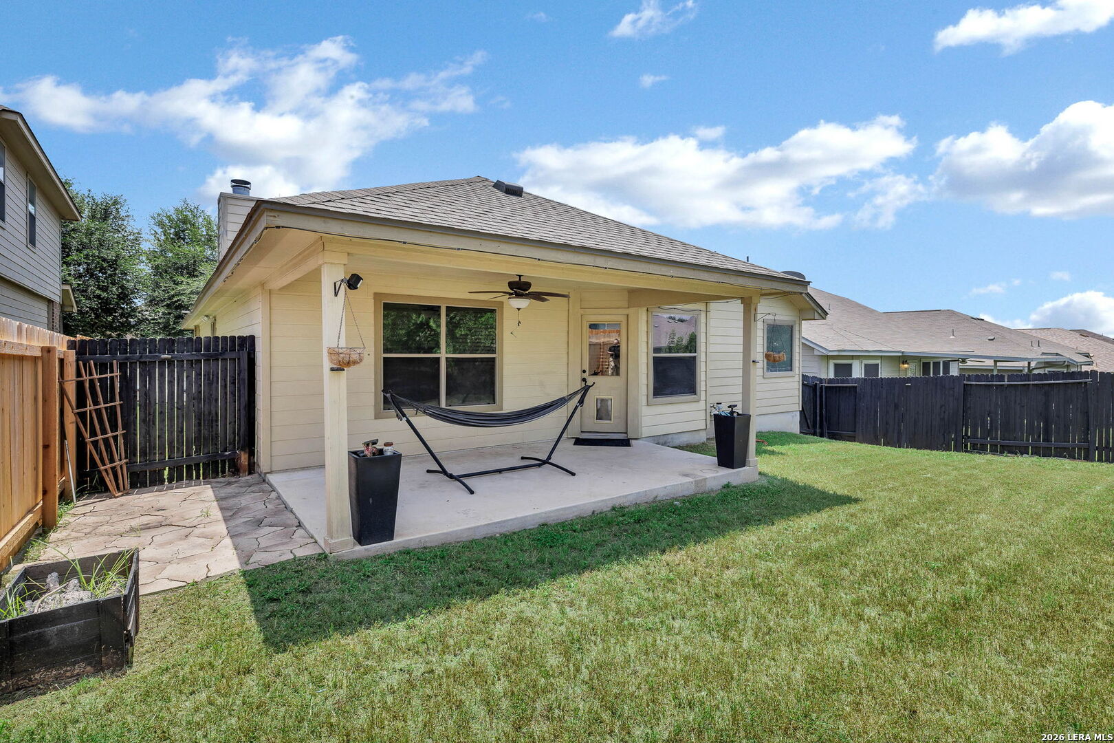 4015 Shervin Way Converse, TX 78109 - Photo 39 of 43 a backyard of a house with table and chairs