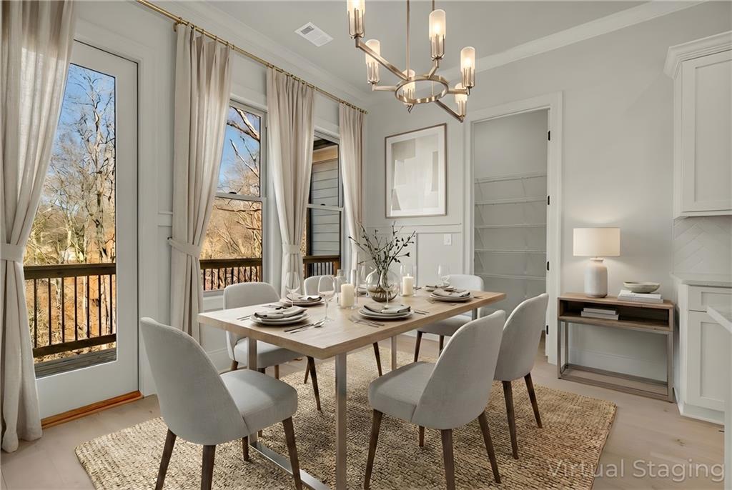 7054 Hammock Trail Gainesville, GA 30506 - Photo 16 of 72 a view of a dining room with furniture window and wooden floor