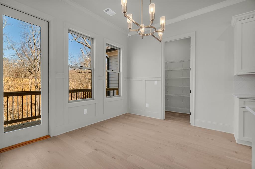 7054 Hammock Trail Gainesville, GA 30506 - Photo 17 of 72 wooden floor in an empty room with a window