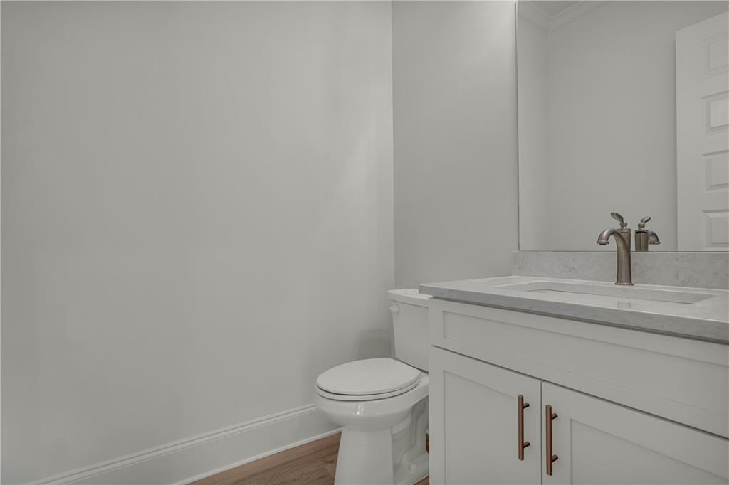 7054 Hammock Trail Gainesville, GA 30506 - Photo 24 of 72 a bathroom with a toilet and a sink