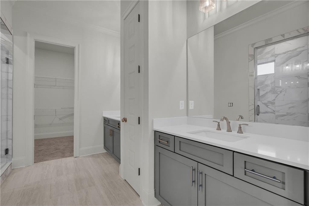 7054 Hammock Trail Gainesville, GA 30506 - Photo 27 of 72 a bathroom with a sink and a mirror