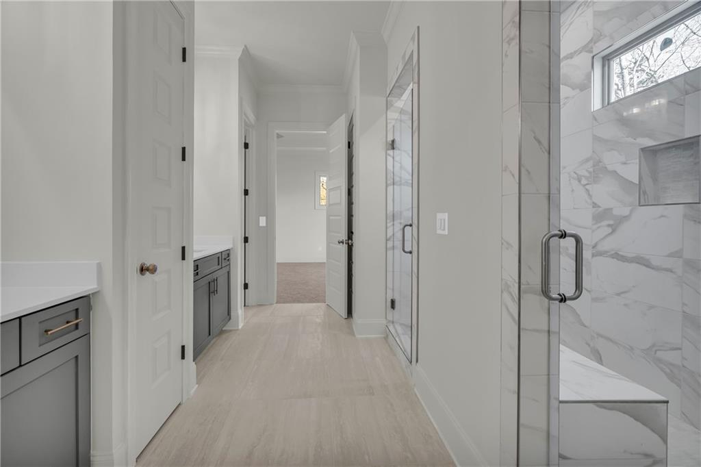 7054 Hammock Trail Gainesville, GA 30506 - Photo 29 of 72 a bathroom with a shower and a glass door