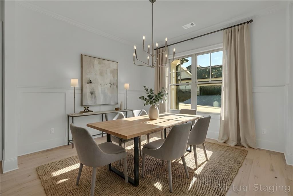 7054 Hammock Trail Gainesville, GA 30506 - Photo 5 of 72 a view of a dining room with furniture window and wooden floor