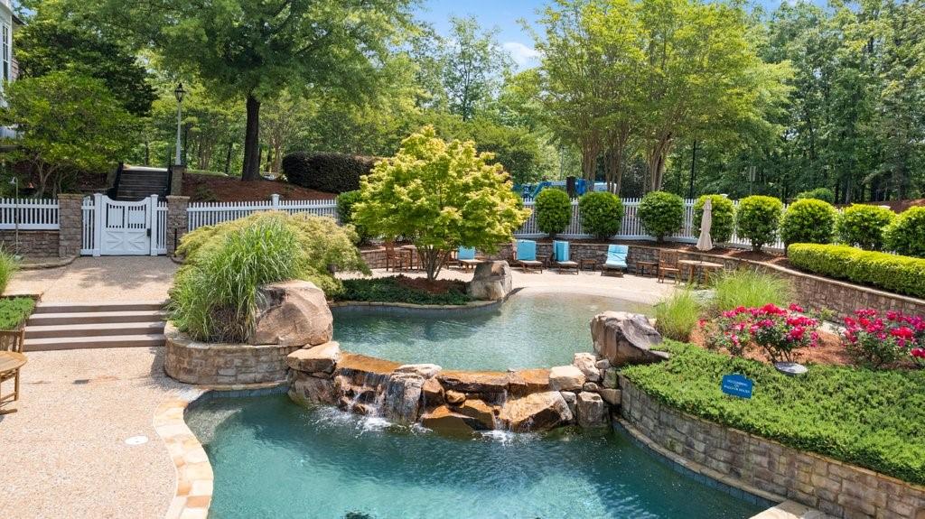 7054 Hammock Trail Gainesville, GA 30506 - Photo 62 of 72 a view of a swimming pool with a patio and plants