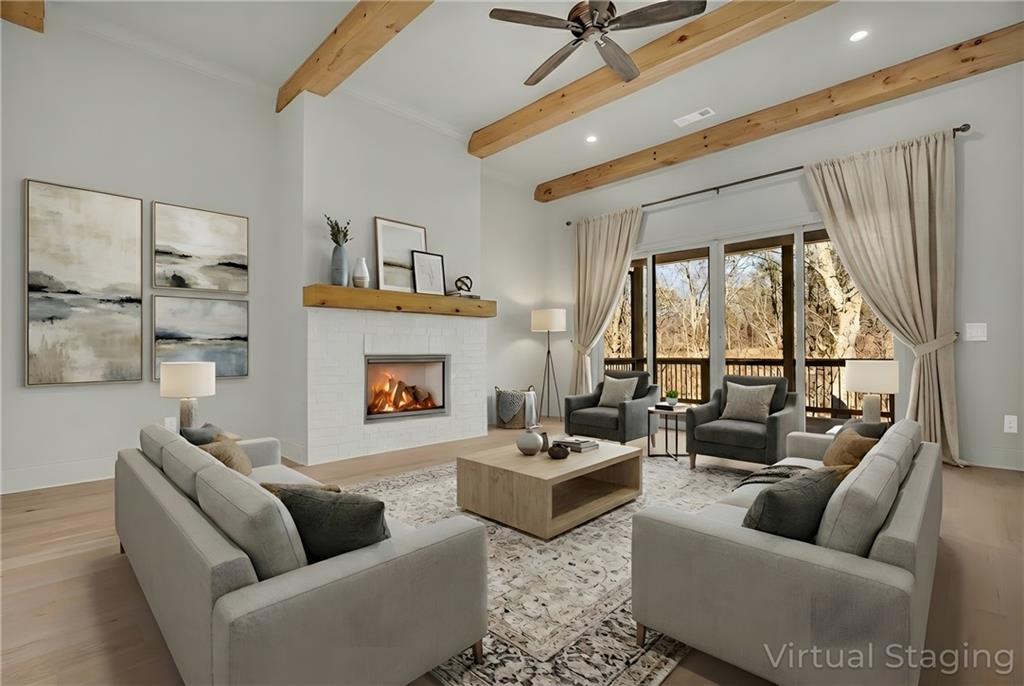 7054 Hammock Trail Gainesville, GA 30506 - Photo 7 of 72 a living room with furniture fireplace and a large window