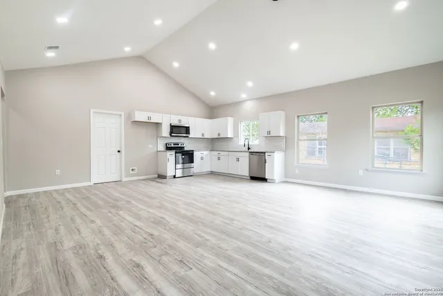 a view of kitchen and wooden floor