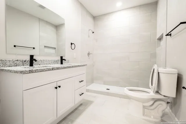 a bathroom with a sink toilet and tub