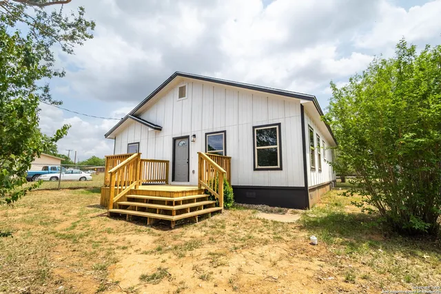 a house view with a garden space