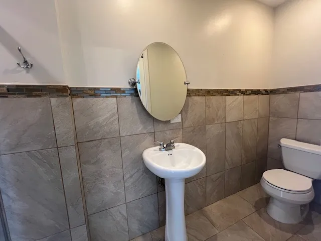 a bathroom with a bathtub and shower