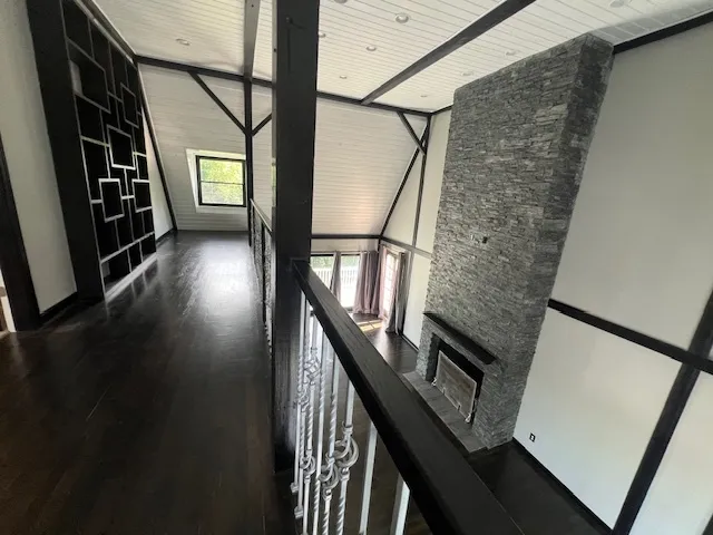 a view of a house with wooden fence