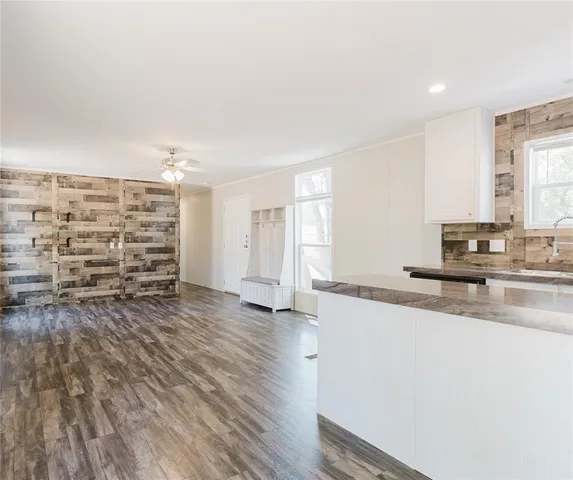 a view of kitchen with sink and wooden floor