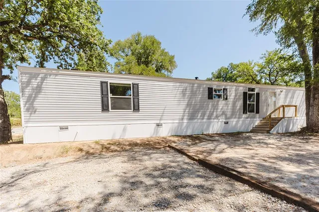 a view of a backyard of a house