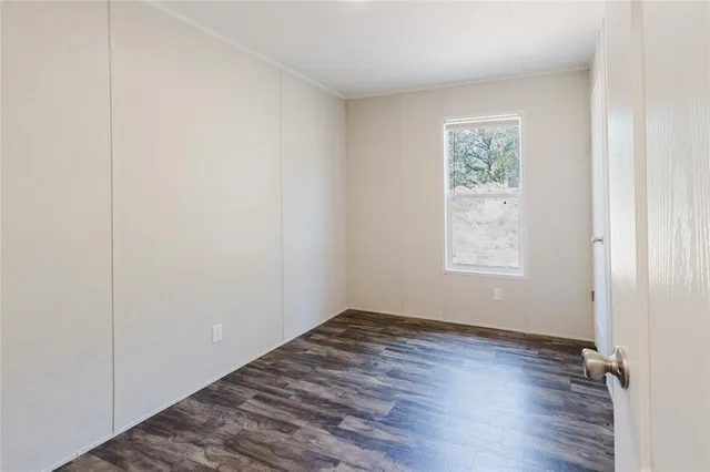 a view of a small space with wooden floor