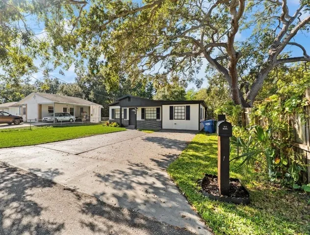 a view of a backyard with sitting area