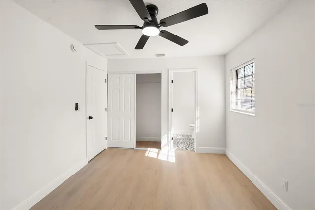 a white toilet sitting next to a shower curtain