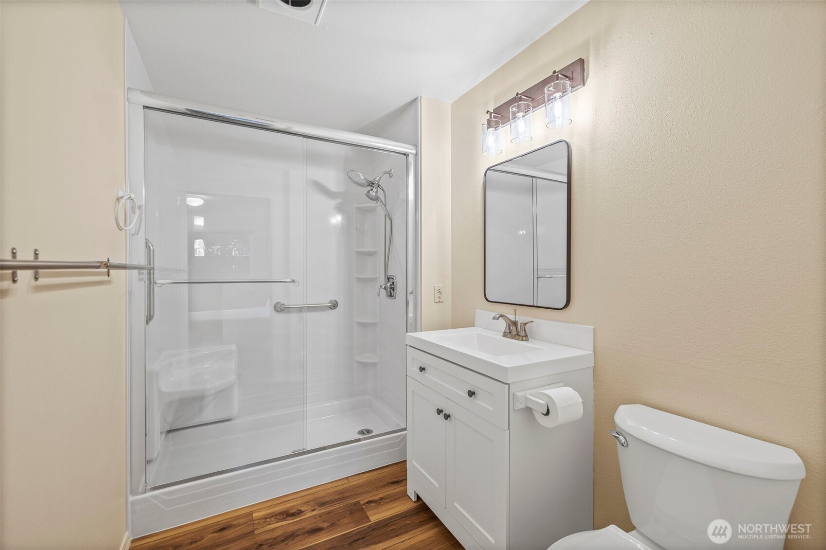 10824 Southeast 170th Street, Unit B103 Renton, WA 98055 - Photo 19 of 31 a bathroom with a sink a toilet and shower