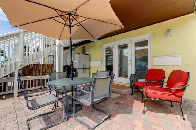 a view of a chairs and tables in the patio
