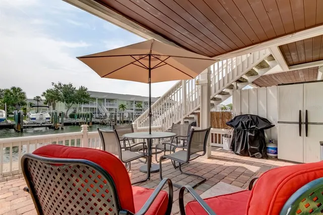 a view of a chairs and table in the patio